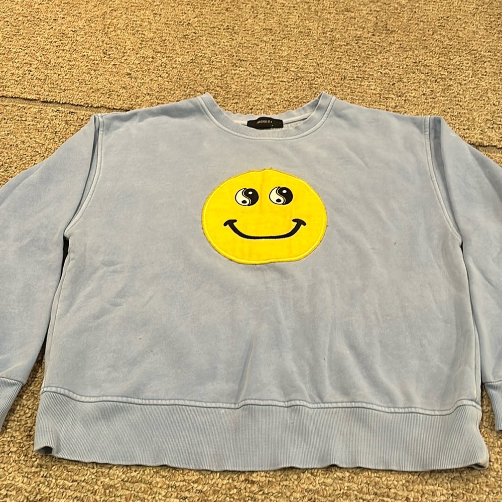 Smiley face blue sweater